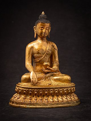 Nepali bronze Buddha statue on lotus throne, full front view with earth-touching gesture