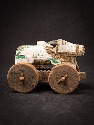 Indian wooden Nandi bull statue on wheels, right view with head facing right