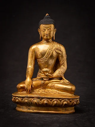 Nepali bronze Buddha statue seated, full front view on lotus base with bhumisparsha mudra