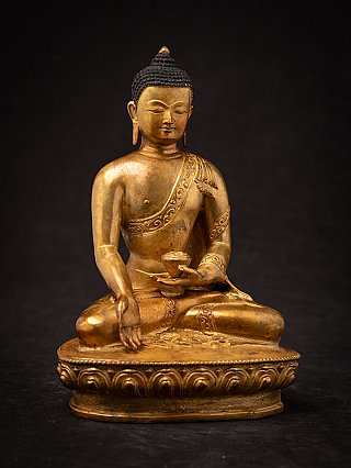 Nepali bronze Buddha statue holding a bowl and showing varada mudra, full front view