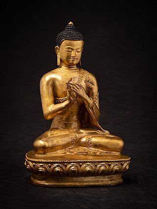 Sitzende Buddha-Statue aus Nepal in Bronze, Dharmachakra-Mudra, leicht gedrehte Vorderansicht