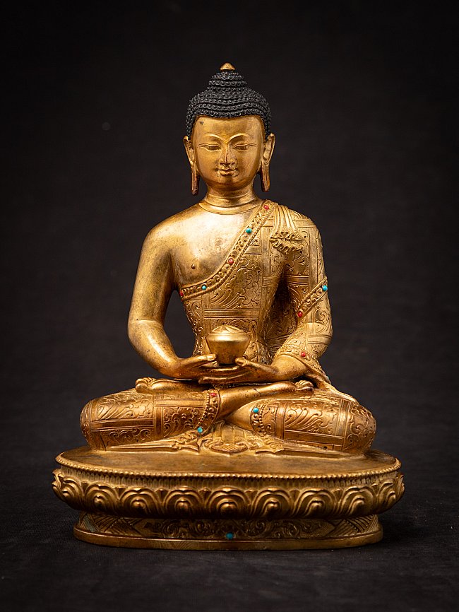 Nepali bronze Buddha statue seated in dhyana mudra on an oval lotus base, full-front view