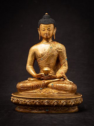 Nepali bronze Buddha statue seated in dhyana mudra on an oval lotus base, full-front view
