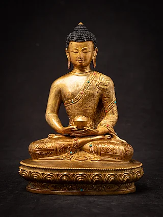 Nepali bronze Buddha statue seated in dhyana mudra on an oval lotus base, full-front view