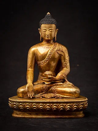 Nepali bronze Buddha statue, full front view seated on lotus base with varada mudra