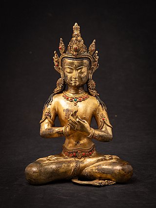 Nepali bronze Buddha statue with crown, seated front view, Dharmachakra mudra