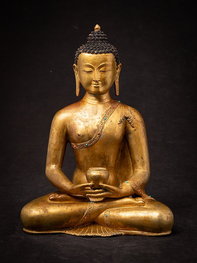 Old bronze Nepali Buddha statue
