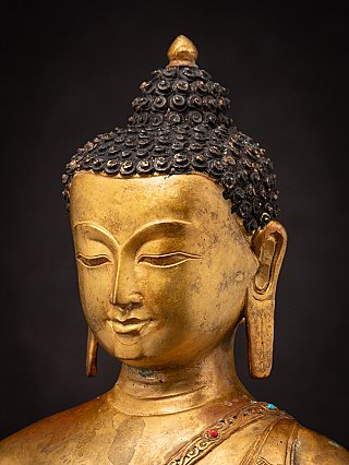 Old bronze Nepali Buddha statue