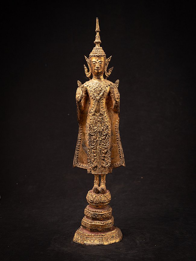 Thai bronze Buddha statue standing in Abhaya mudra, full front view on tiered base