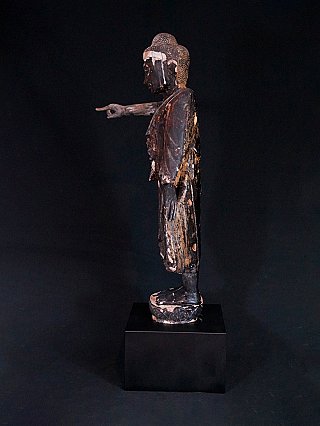 Antique standing Mandalay Buddha statue, wooden, side profile with outstretched hand