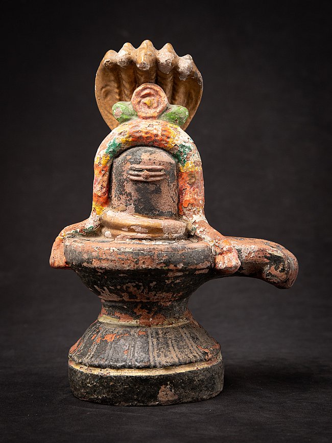 Indian terracotta Shiva lingam on pedestal, full-front view with multi-hooded cobra canopy