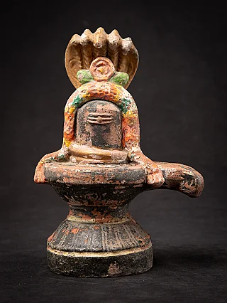 Indian terracotta Shiva lingam on pedestal, full-front view with multi-hooded cobra canopy