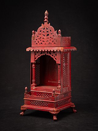 Wooden shrine from Nepal with pierced side panels and open niche, three-quarter view