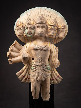 Front close-up of the Panchamukhi Hanuman marble statue, focusing on the five faces and halo