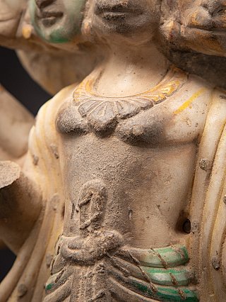 Detail of the chest and necklace on the Panchamukhi Hanuman marble statue, with paint and gilding