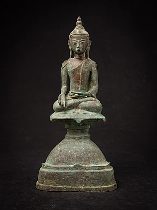 Burmese bronze Buddha statue seated in Varada mudra, full front view on tall base