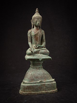 Burmese bronze Buddha statue seated in Varada mudra, slightly angled front view