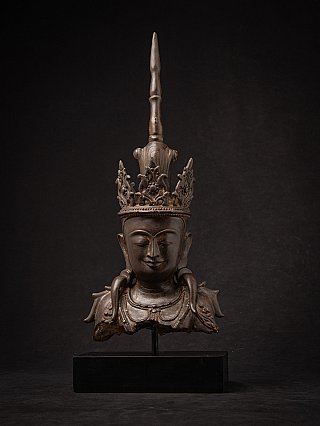 Burmese bronze Buddha head, front view on stand with tall crown and serene face