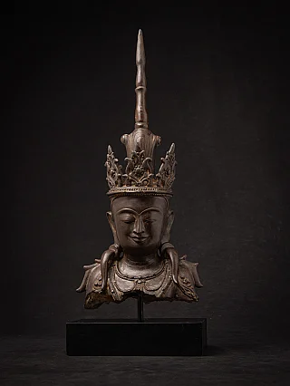 Burmese bronze Buddha head, front view on stand with tall crown and serene face