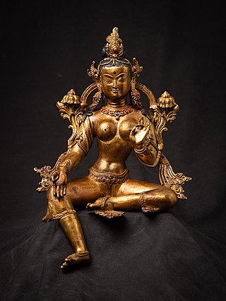 Nepali Green Tara bronze statue, frontal seated view with jewellery and lotus stems behind the shoulders