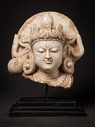 Large antique Indian marble Bodhisattva head with crown and ear ornaments, front view