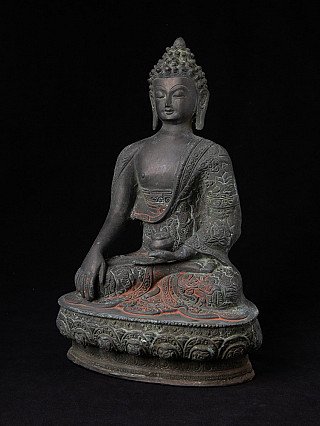 Bronze Buddha statue from Nepal, three-quarter view showing bowl in the left hand