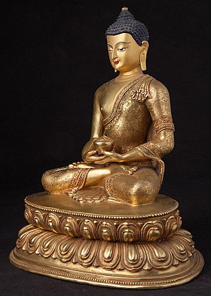 Bronze Buddha statue from Nepal with engraved robe and offering bowl, three-quarter left view