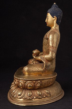 Nepali bronze Buddha statue seated with bowl in lap, right side profile