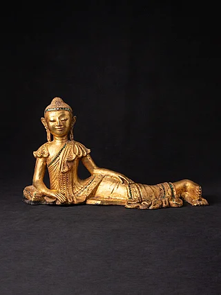 Reclining Buddha statue from Burma (Myanmar), lacquerware with green inlay, three-quarter view