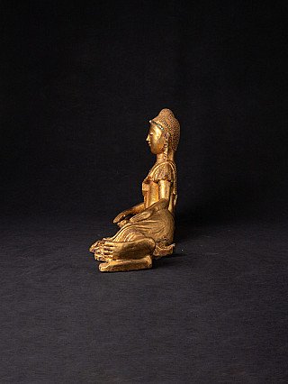 Reclining Buddha statue in Burmese lacquerware, right side profile view