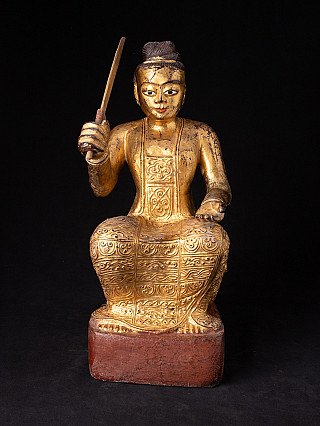 Antique Burmese Nat statue in wood with gilded finish, seated with raised sword, front view