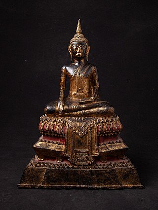 Thai bronze Buddha statue seated in bhumisparsha mudra, full front view on red and gold base
