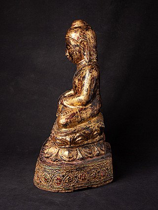 Seated wooden Ava Buddha statue from Burma, left side profile