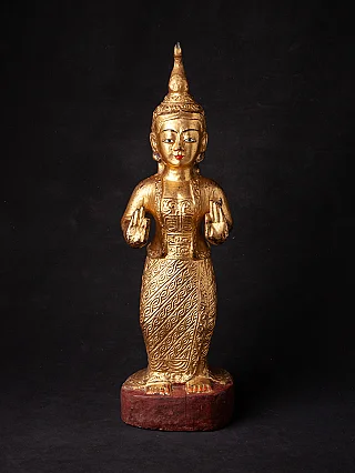 Antique wooden Burmese Nat statue standing with vitarka mudra, full front view