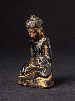 Burmese lacquerware Buddha statue with worn gilding, seated, three-quarter view