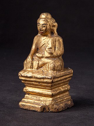 Burma (Myanmar) wooden Buddha statue on tiered base, three-quarter left view