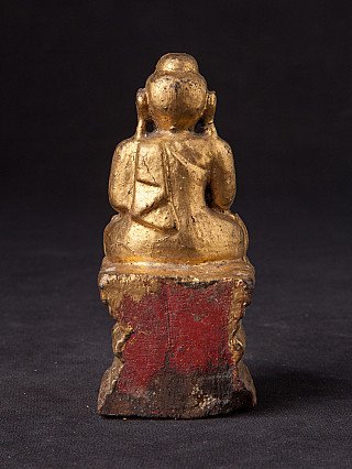 Wooden Buddha statue from Burma (Myanmar), rear view with red paint on the base
