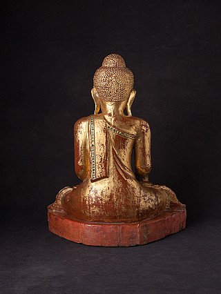 Mandalay Buddha statue in wood, rear view showing draped robe and back of head