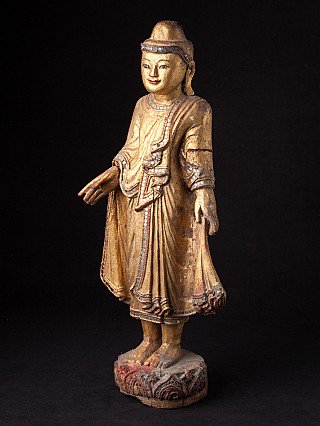 Wooden Buddha statue from Burma (Myanmar), three-quarter left view showing extended hand