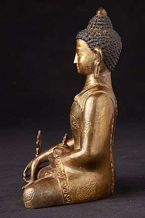 Sitzende Medizinbuddha-Statue aus Nepal in Bronze, linke Seitenansicht mit Schale