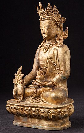Medizinbuddha-Statue aus Nepal in Bronze mit Krone, sitzend, Dreiviertelansicht links
