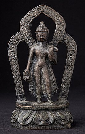 Nepali bronze Buddha statue on lotus base with openwork aureole, full front view
