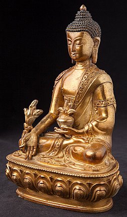 Medizinbuddha-Statue aus Nepal in Dreiviertelansicht, mit Schale in der Hand und Lotussockel