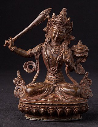 Manjushri bronze statue from Nepal, seated on lotus base holding sword and lotus, front view