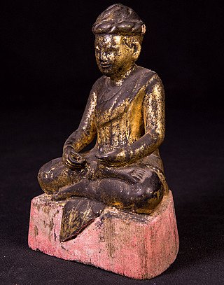Antique wooden monk statue