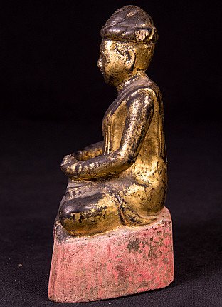 Antique wooden monk statue