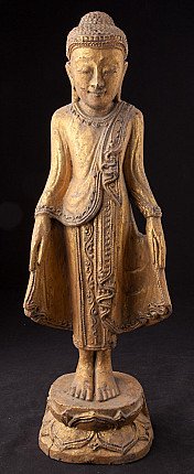 Stehende Buddha-Statue aus Holz aus Burma (Myanmar), Frontalansicht auf Sockel mit goldfarbener Fassung