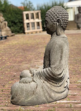 Indonesian lavastone Buddha statue, seated, left side profile view