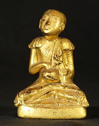 Antique Burmese monk statue in lacquerware, seated, three-quarter front view