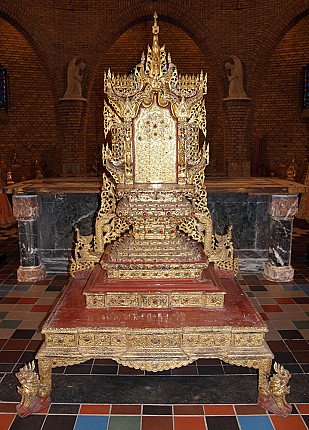 Large antique Burmese wooden throne from Myanmar, full front view with gilded carving